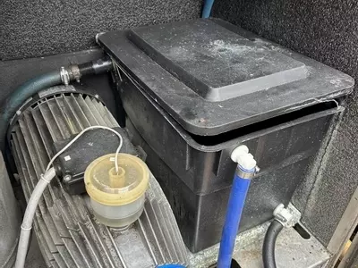 Original inlet water tank setup on a Nilfisk SH Truck prior to modification. The existing configuration was prone to inconsistent supply and required upgrading to improve flow stability and overall machine reliability.